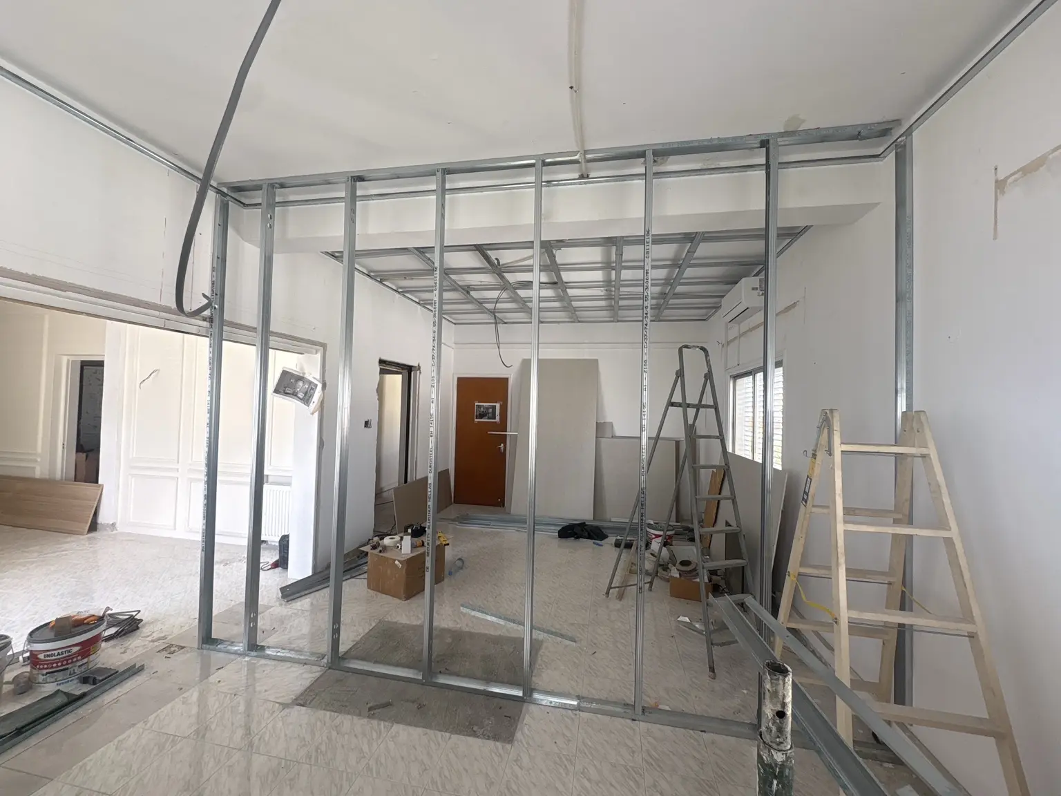 Metal frame construction for a new interior partition